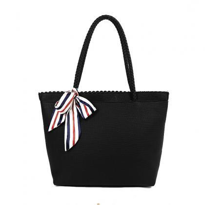 Faux Leather Tote Bag Featuring Striped Bow Accent..